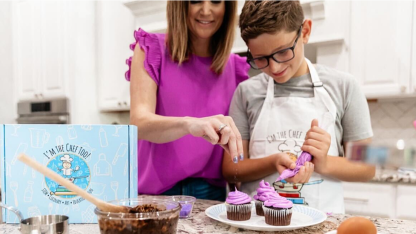 A mother and son playing with I'm the Chef Too products